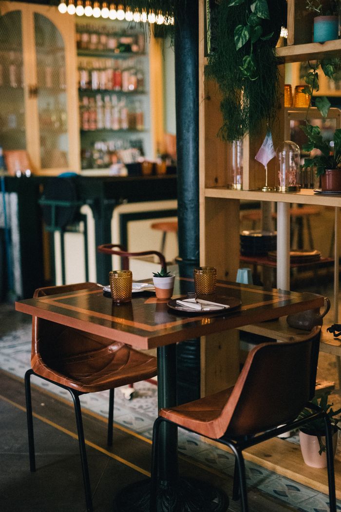 portfolio-02 A stylish and modern bar with wooden seating, ready for guests. Perfect ambiance.